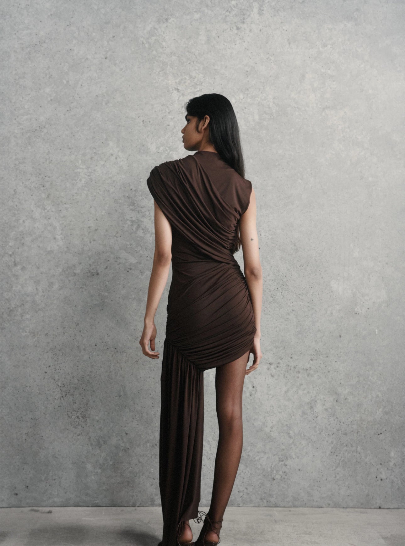 ravenna mini dress in chocolate brown jersey De La Vali Ravenna mini in chocolate brown jersey (also available in taupe, sizes 4, 8 and 10 and blue) Sizes 6, 8, 10 RRP: $710 (incl. shipping) Rental price: $160 (includes cleaning and GST)